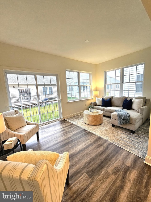 living room with dark wood finished floors and baseboards
