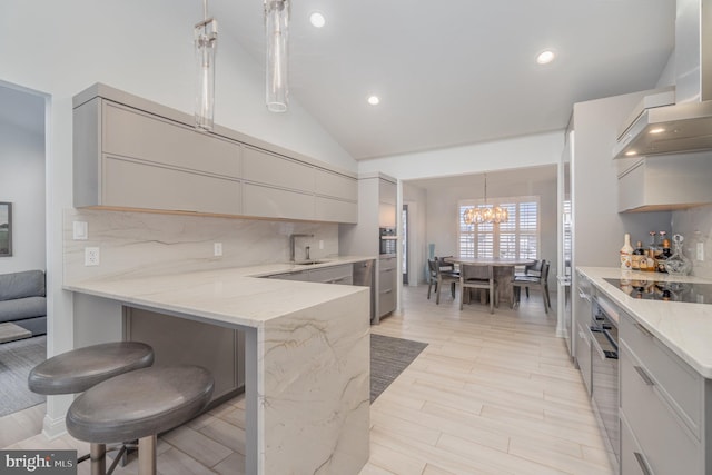 1222 Brian Ln, Hanover, PA 17331 - kitchen featuring black electric stovetop, wall chimney range hood, stainless steel oven, light stone countertops, and pendant lighting