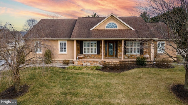 1222 Brian Ln, Hanover, PA 17331 - view of front of house with stone siding, a front lawn, a shingled roof, stucco siding, and covered porch