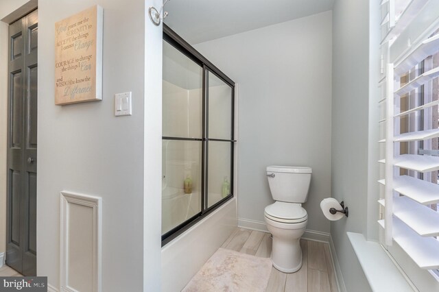 1222 Brian Ln, Hanover, PA 17331 - bathroom featuring toilet, combined bath / shower with glass door, and baseboards