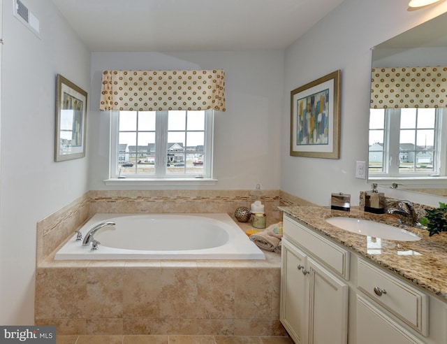 1300 Carrick Court Massey Elite Model, Middletown, DE 19709 - bathroom with plenty of natural light, a garden tub, and vanity