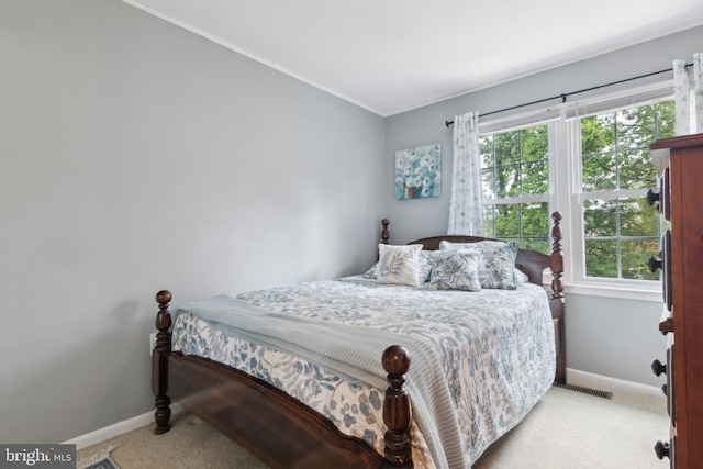 12328 Woodlawn Ct, Woodbridge, VA 22192 - bedroom featuring light carpet, baseboards, multiple windows, and ornamental molding
