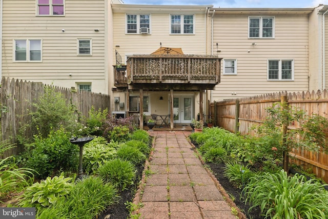 12328 Woodlawn Ct, Woodbridge, VA 22192 - rear view of property featuring french doors, a deck, and a fenced backyard