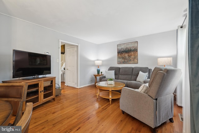 12328 Woodlawn Ct, Woodbridge, VA 22192 - living room featuring wood finished floors and baseboards