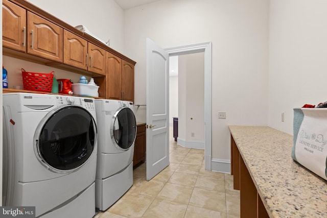 14815 Dover Rd, Reisterstown, MD 21136 - washroom featuring light tile patterned floors, cabinet space, and washing machine and clothes dryer