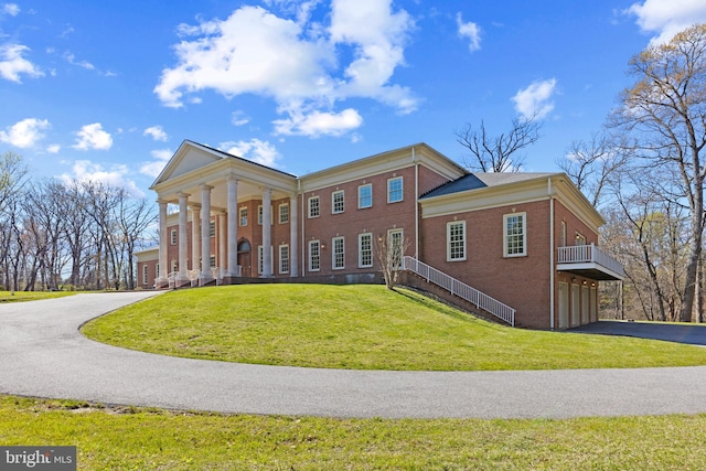 14815 Dover Rd, Reisterstown, MD 21136 - view of front of house with a garage, brick siding, a front lawn, and driveway