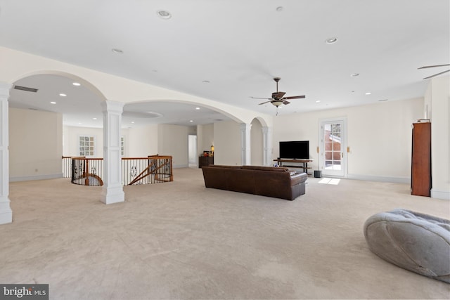 14815 Dover Rd, Reisterstown, MD 21136 - living room with recessed lighting, a ceiling fan, light carpet, ornate columns, and arched walkways