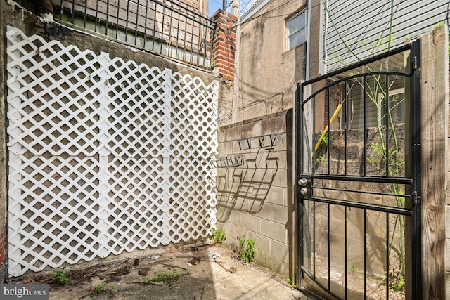 exterior space featuring a gate