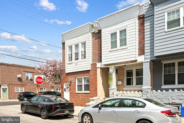 townhome / multi-family property with brick siding