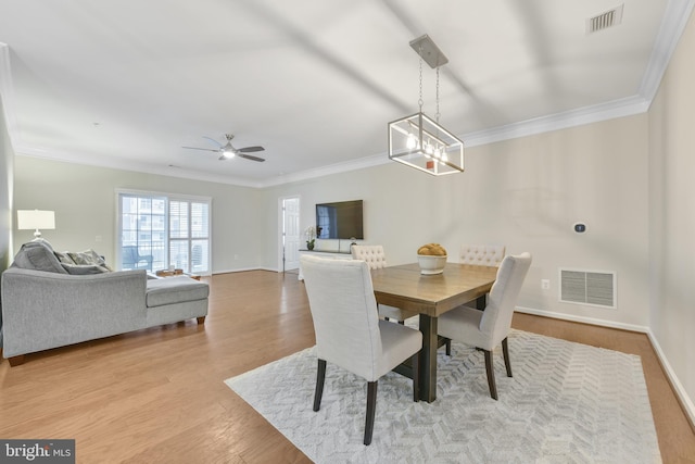 20620 Hope Spring Ter Unit 206, Ashburn, VA 20147 - dining space with ornamental molding, wood finished floors, ceiling fan, baseboards, and a chandelier