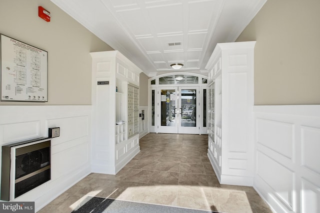 20620 Hope Spring Ter Unit 206, Ashburn, VA 20147 - corridor featuring french doors, wainscoting, and a decorative wall