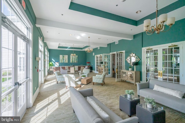 20620 Hope Spring Ter Unit 206, Ashburn, VA 20147 - sunroom with french doors, a chandelier, and beamed ceiling