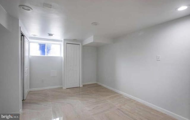 unfurnished bedroom with baseboards, recessed lighting, and multiple closets