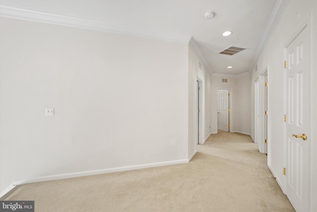 corridor with baseboards, ornamental molding, light carpet, and recessed lighting