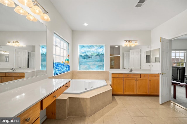 bathroom with tile patterned flooring, visible vents, a jetted tub, a shower stall, and a sink