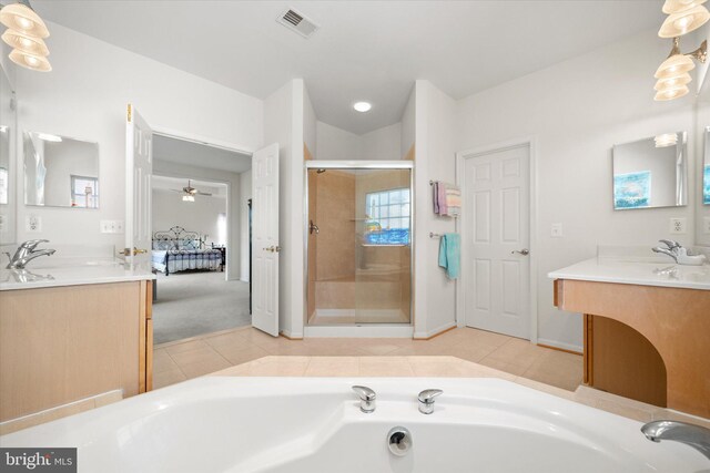 bathroom with vanity, tile patterned floors, a garden tub, and a stall shower