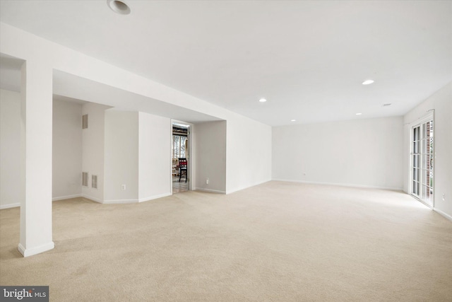 basement with light colored carpet, recessed lighting, baseboards, and visible vents