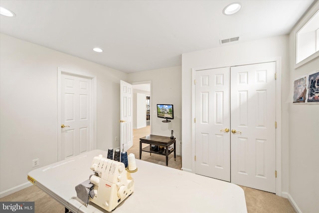 bedroom featuring baseboards, light colored carpet, recessed lighting, and visible vents