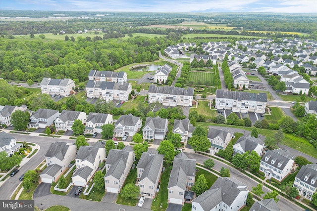 birds eye view of property featuring a water view and a residential view