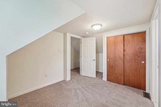 bonus room featuring visible vents, carpet, and baseboards