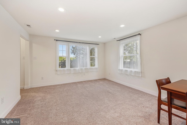 interior space with plenty of natural light, carpet flooring, baseboards, and recessed lighting