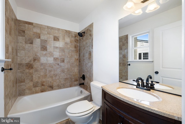 full bathroom with toilet, vanity, and shower / tub combination