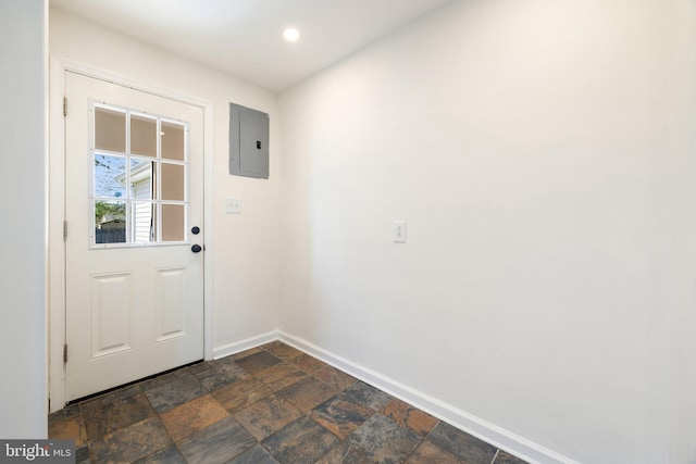doorway to outside featuring stone tile floors, electric panel, baseboards, and recessed lighting