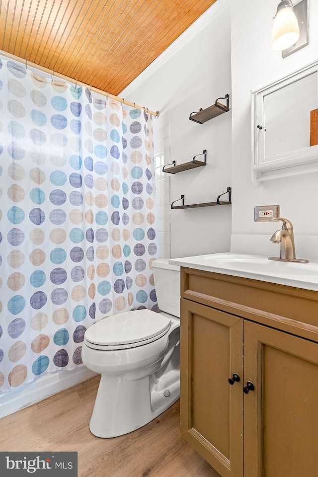 bathroom with vanity, wood finished floors, toilet, a shower with shower curtain, and wooden ceiling