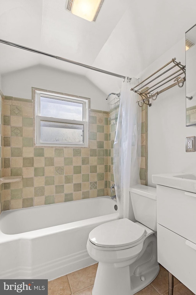 bathroom with tile patterned flooring, shower / bath combo with shower curtain, toilet, and vanity