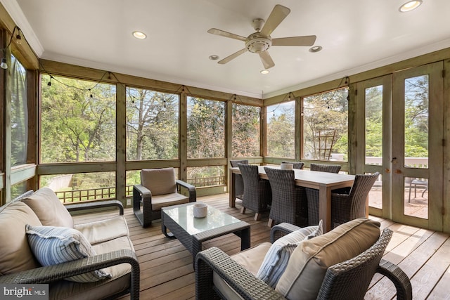 sunroom with ceiling fan, french doors, an outdoor hangout area, and outdoor dining area