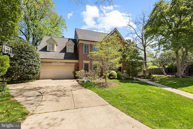 view of front of house with brick siding, driveway, and a shingled roof