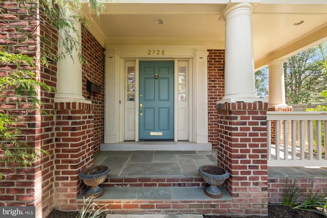 entrance to property with brick siding