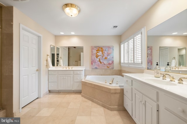 full bath featuring a garden tub, tile patterned floors, two vanities, recessed lighting, and tiled shower