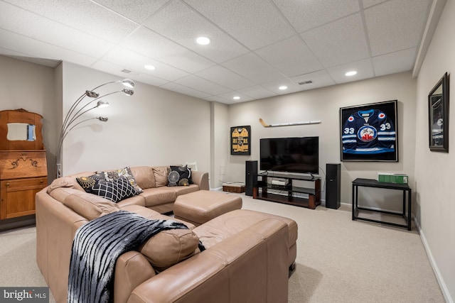 living room with light colored carpet, recessed lighting, a drop ceiling, and baseboards
