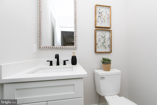 half bath with toilet and vanity