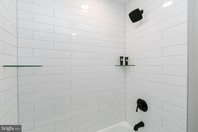 bathroom with bathing tub / shower combination