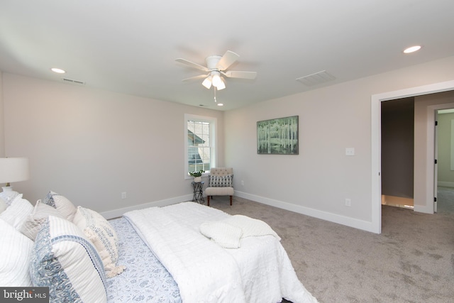 carpeted bedroom with baseboards, visible vents, and recessed lighting