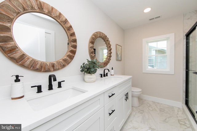 bathroom featuring recessed lighting, marble finish floor, a sink, and visible vents
