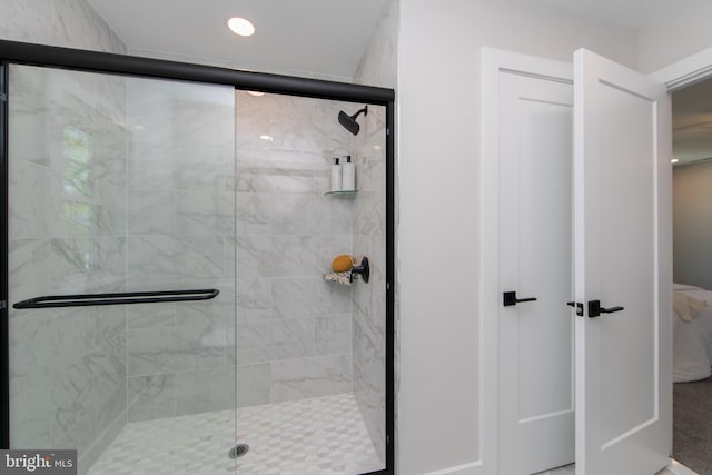 bathroom with a shower stall and recessed lighting