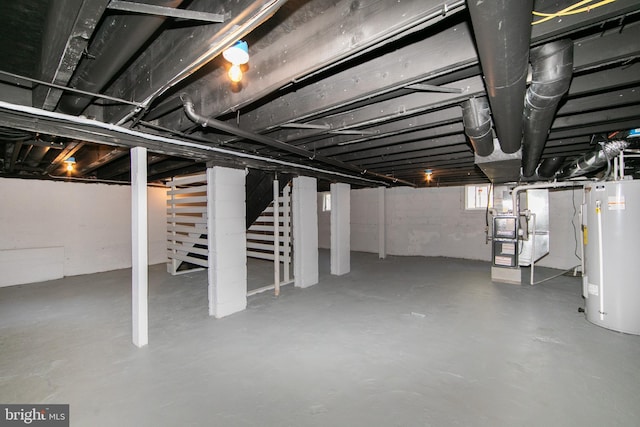 below grade area featuring heating unit, water heater, and stairs