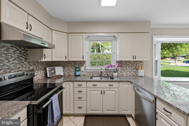 2314 Concert Ct, Vienna, VA 22181 - kitchen featuring a sink, stainless steel appliances, under cabinet range hood, light tile patterned flooring, and a wealth of natural light