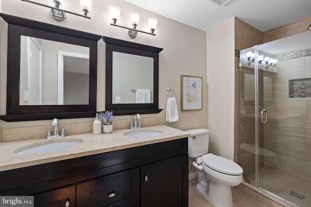2314 Concert Ct, Vienna, VA 22181 - full bathroom featuring toilet, a stall shower, double vanity, and a sink