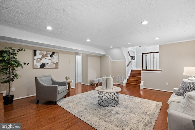 2314 Concert Ct, Vienna, VA 22181 - living area with a textured ceiling, wood finished floors, baseboards, and stairs