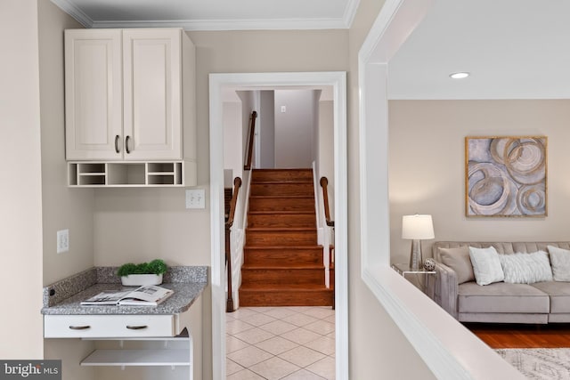 stairs with ornamental molding, recessed lighting, and tile patterned floors
