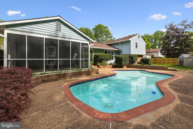 2314 Concert Ct, Vienna, VA 22181 - view of pool featuring a sunroom, an outdoor structure, a fenced in pool, a storage unit, and fence