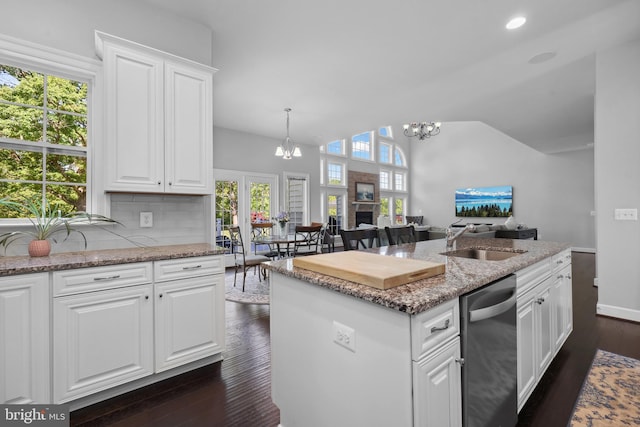 42438 Black Talon Ct, Leesburg, VA 20176 - kitchen featuring dishwasher, a sink, a chandelier, dark wood-style flooring, and white cabinetry