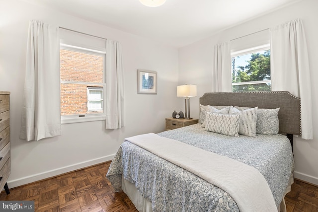 bedroom featuring baseboards