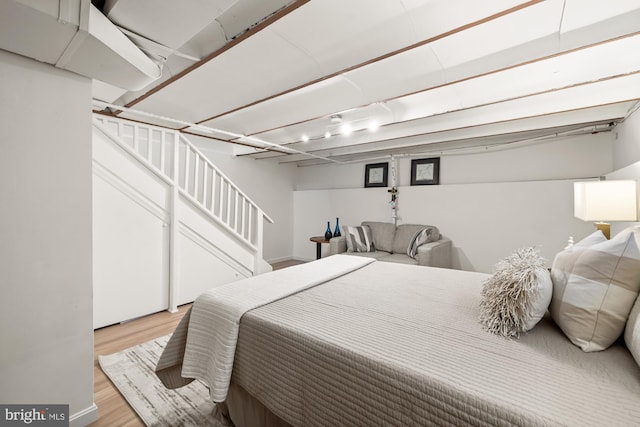bedroom with light wood-style floors