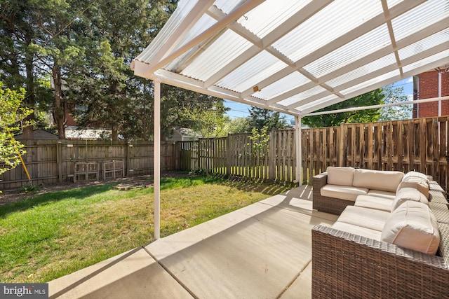 view of patio featuring an outdoor living space and a fenced backyard