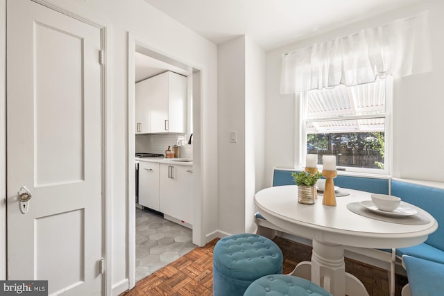 dining room featuring baseboards